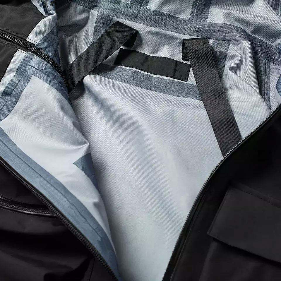 Produttore OEM Nuova giacca a vento con logo personalizzato da uomo, impermeabile, 100% nylon, carico leggero per giacca