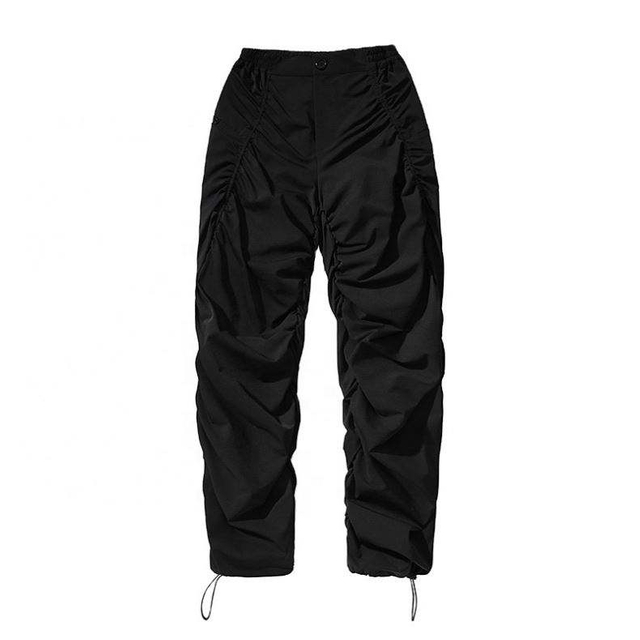 Los pantalones de nylon de la pierna ancha del pie del paquete de la cuerda del drenaje lateral del estilo del dise&ntilde;o del fabricante del OEM venden al por mayor aduana