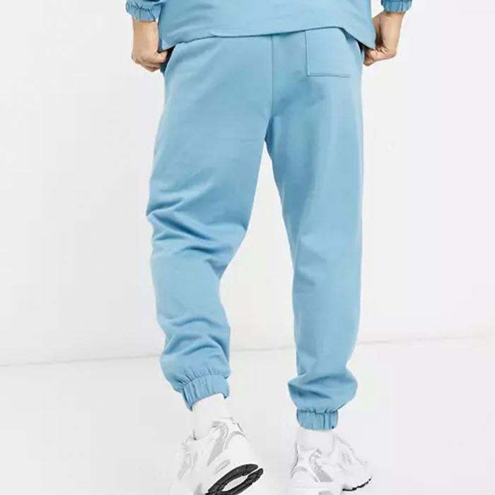 Oem aangepaste elastische manchetten oversized taps toelopende joggingbroek voor heren