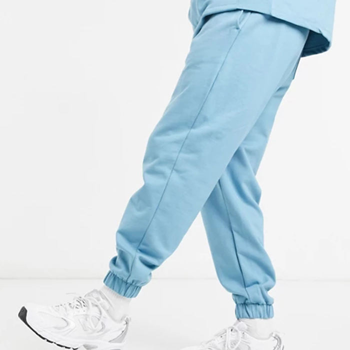 Oem aangepaste elastische manchetten oversized taps toelopende joggingbroek voor heren